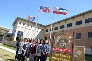 DOM representatives Fran Ingram (from left) and Margaret Wilson visit members of the Choctaw Health Center.